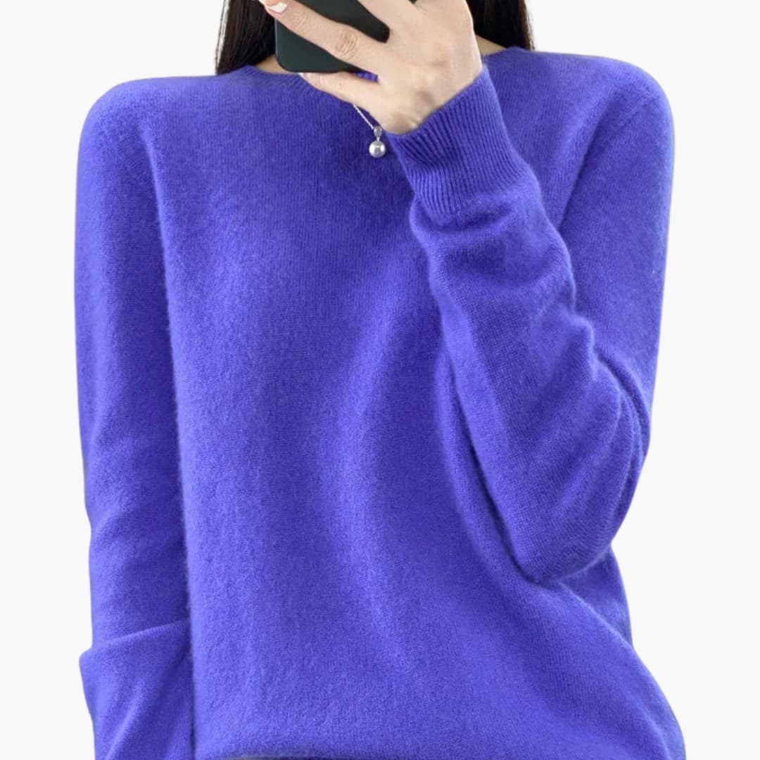Women's minimalist round neck pullover sweater with ribbed cuffs, hem, and timeless knit design