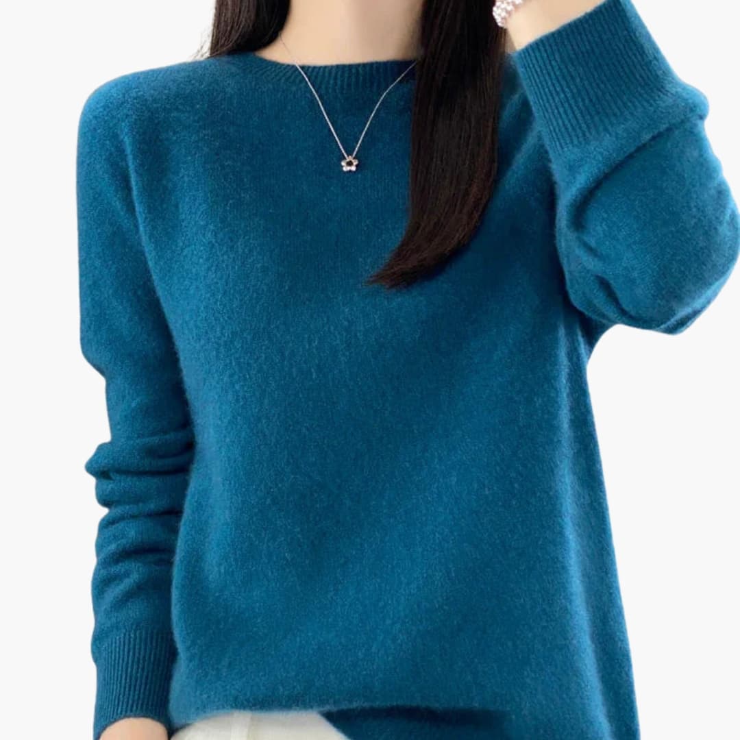 Women's minimalist round neck pullover sweater with ribbed cuffs, hem, and timeless knit design