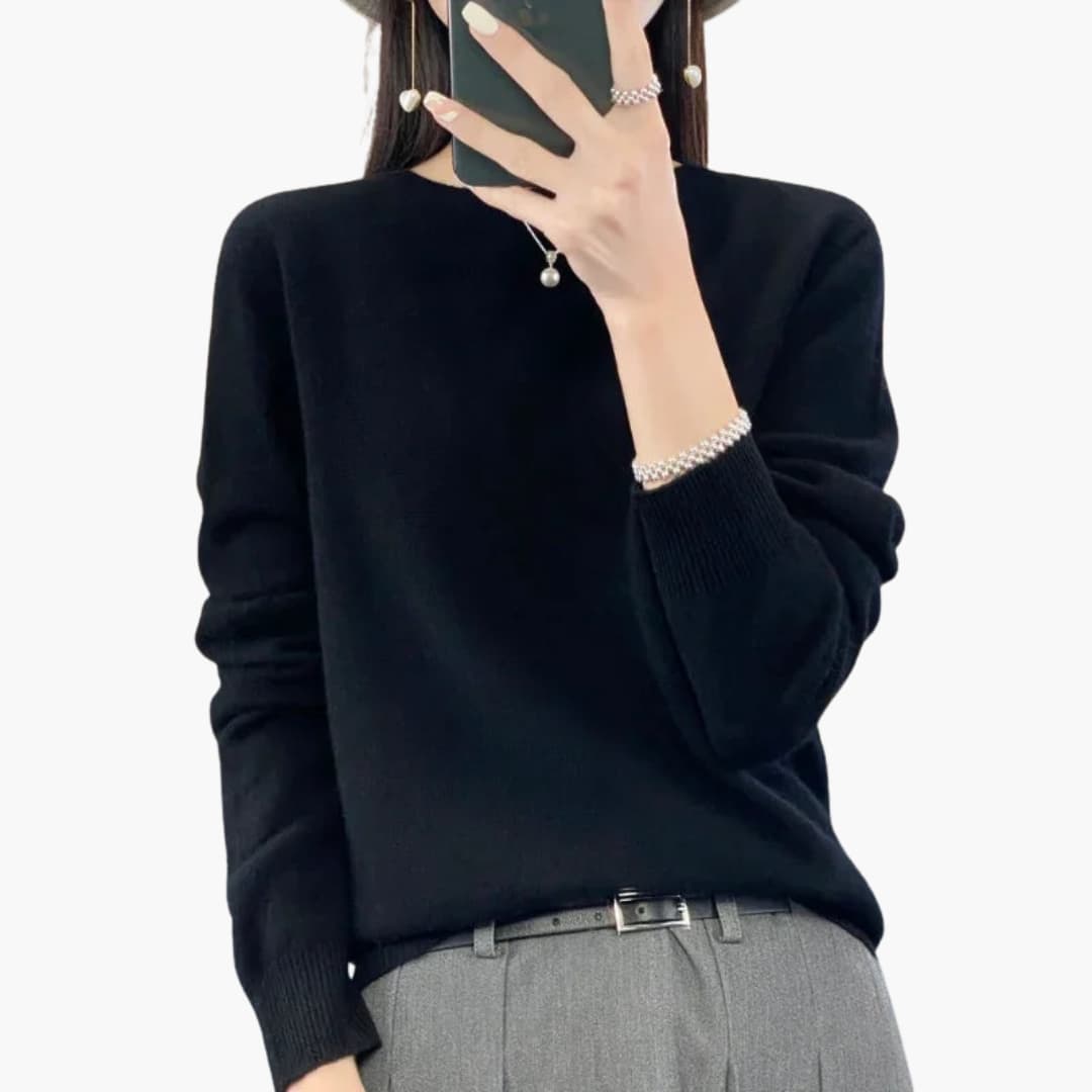 Women's minimalist round neck pullover sweater with ribbed cuffs, hem, and timeless knit design