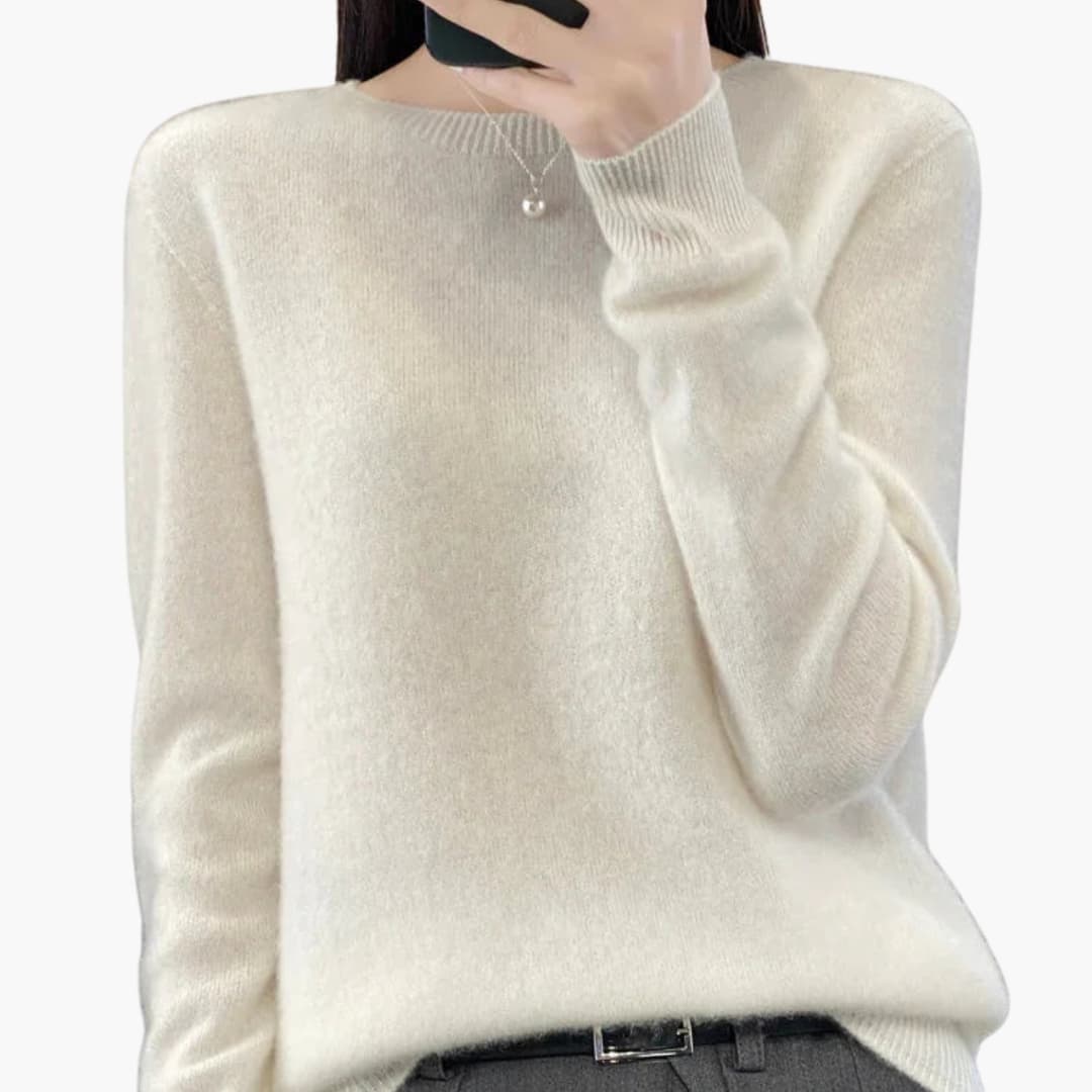 Women's minimalist round neck pullover sweater with ribbed cuffs, hem, and timeless knit design