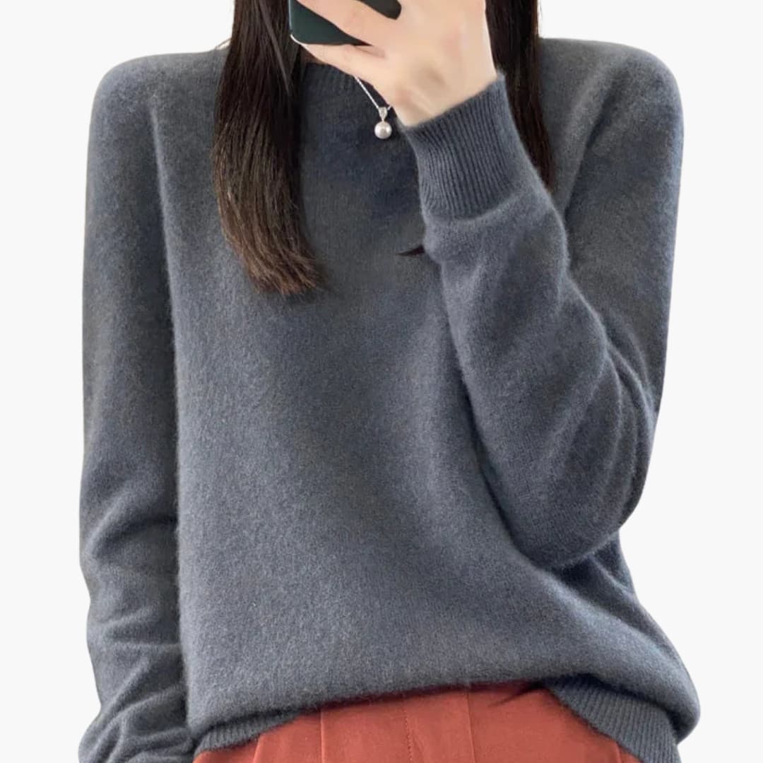 Women's minimalist round neck pullover sweater with ribbed cuffs, hem, and timeless knit design