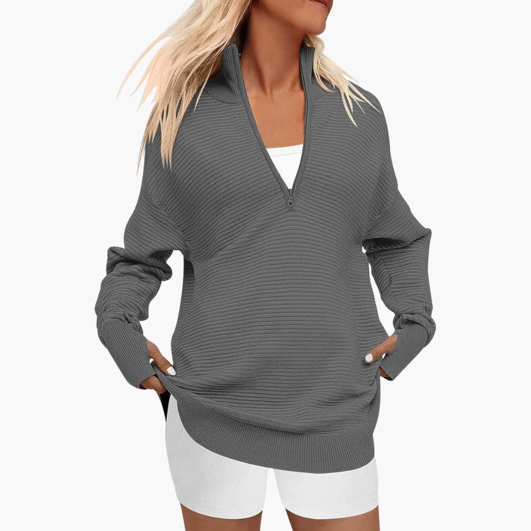 Women's ribbed knit zip-up sweater with high collar, minimalist style, full-length zipper