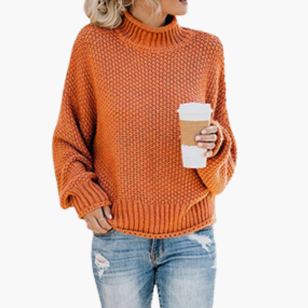 Women's cozy ivory turtleneck pullover with ribbed stand-up collar and textured knit surface