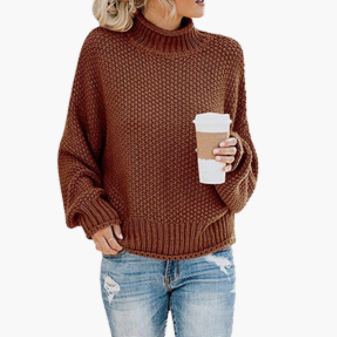 Women's cozy beige turtleneck pullover with ribbed stand-up collar and textured knit surface