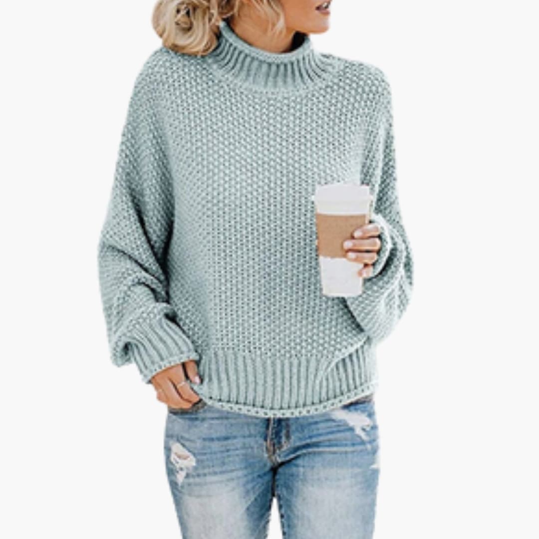Women's cozy oatmeal turtleneck pullover with ribbed stand-up collar and textured knit surface