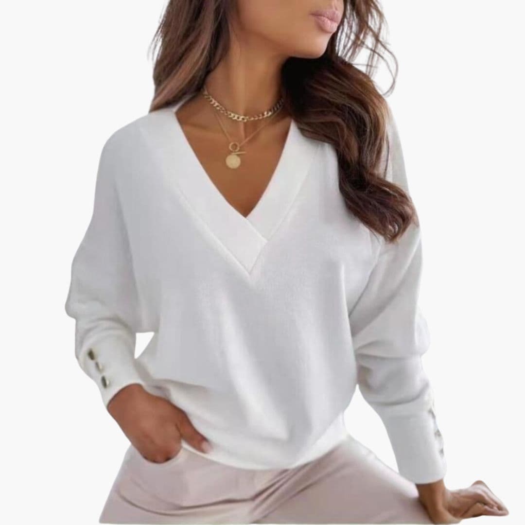 Women's relaxed solid knit V-neck sweater with dropped shoulders and decorative button cuffs