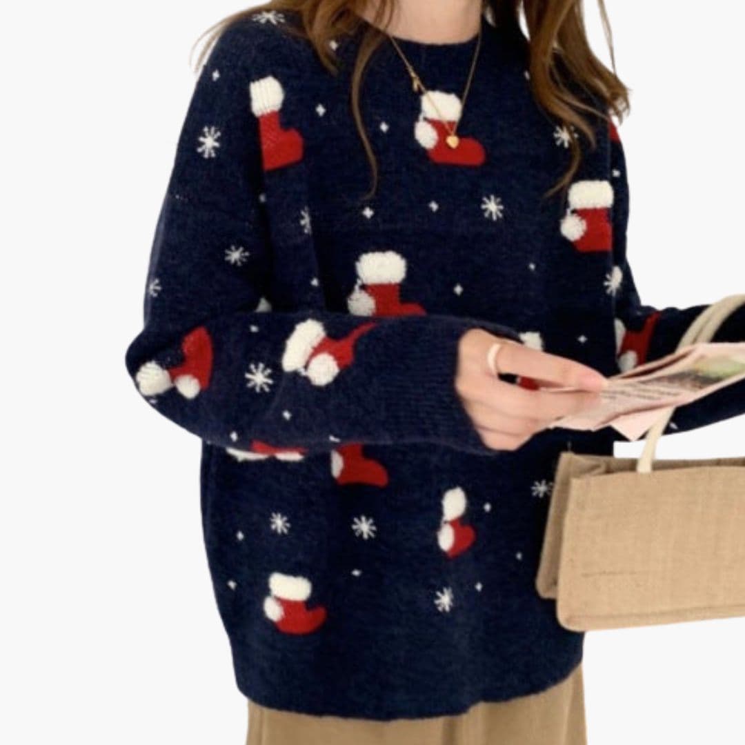 Women's cozy crew neck knit sweater with festive snowflake pattern and ribbed trim