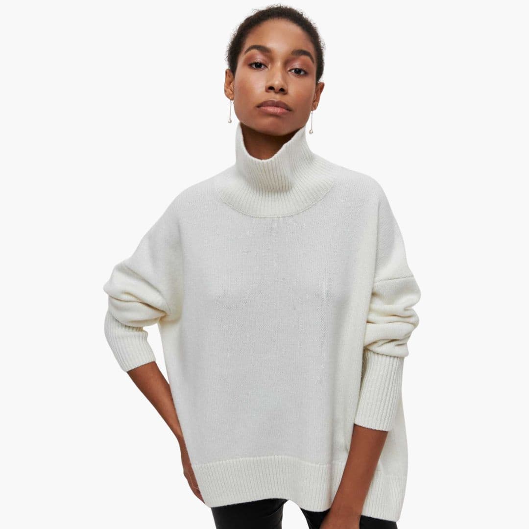 Women's loose fit ribbed turtleneck knit sweater, cozy everyday style with ribbed hem detailing