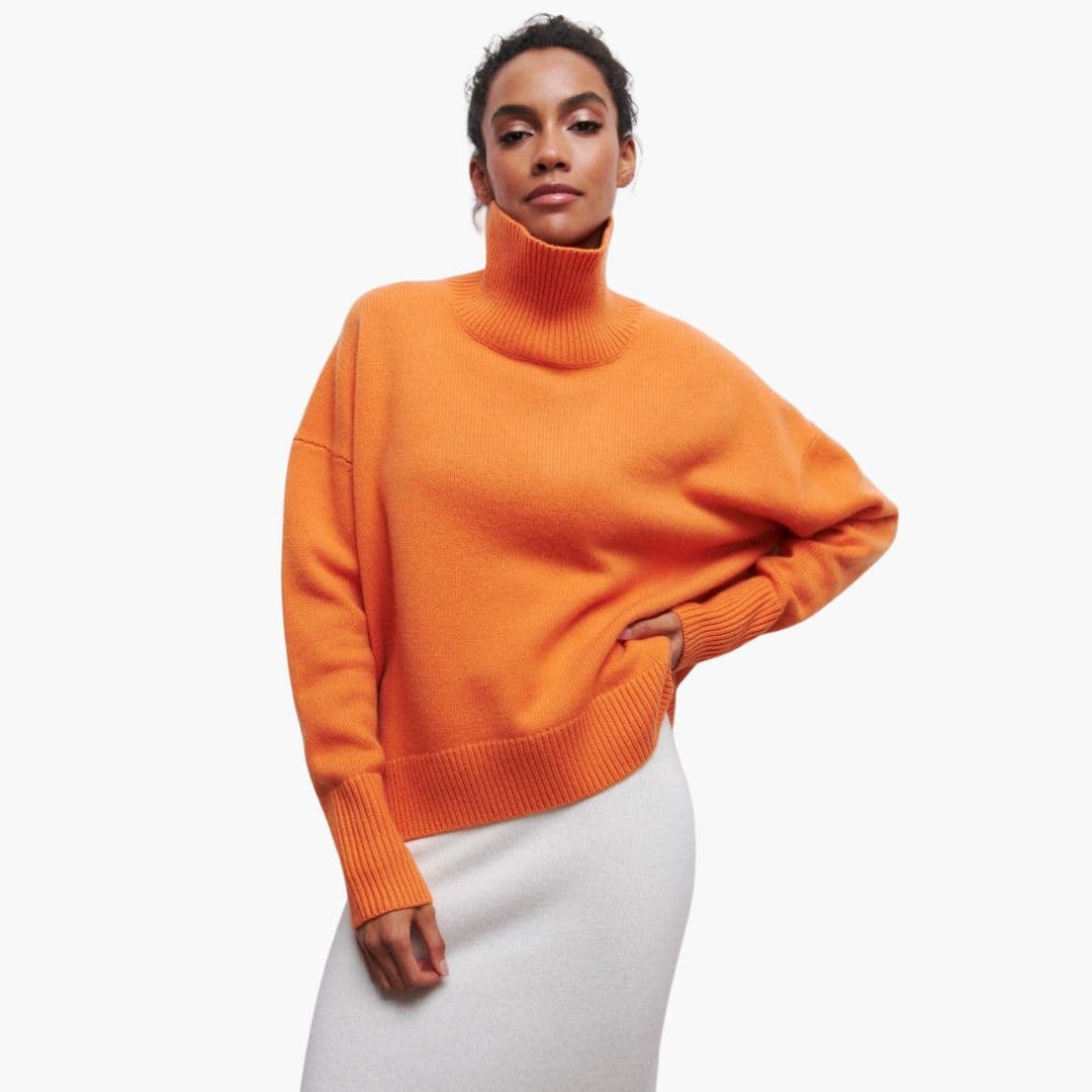 Women's beige ribbed turtleneck knit sweater loose cozy fit with ribbed hem everyday style