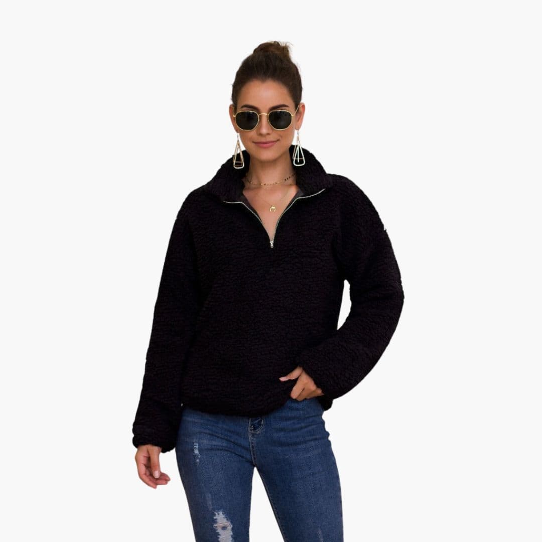 Women's loose fit half-zip fleece pullover with textured surface and stand-up collar for cozy style
