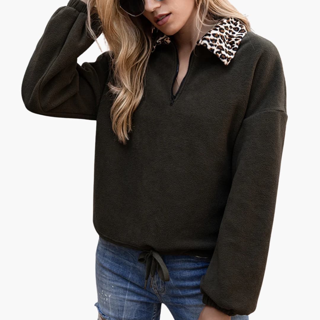 Women's relaxed-fit fleece pullover half-zip with contrasting leopard print collar and adjustable hem