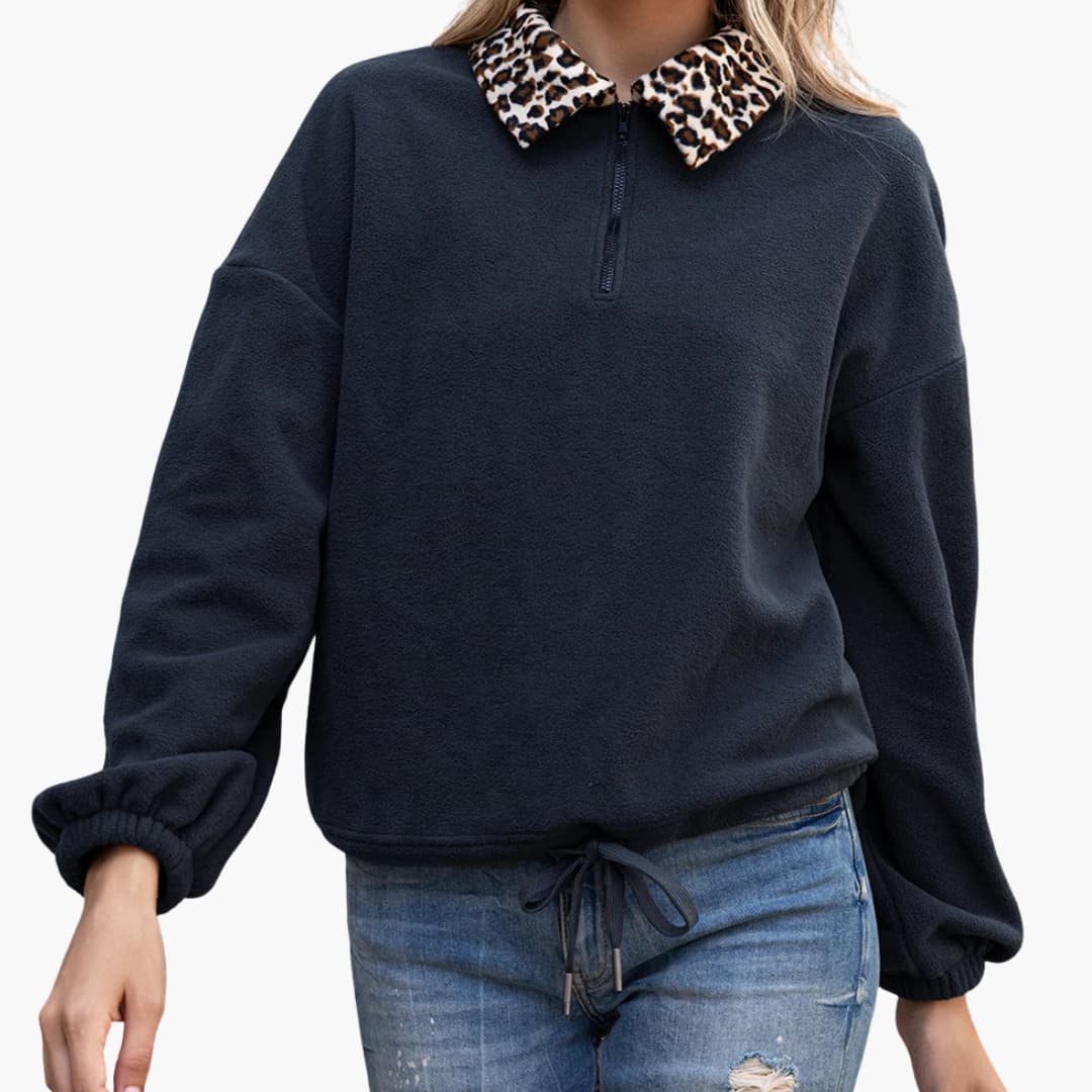Women's relaxed-fit fleece pullover half-zip with contrasting leopard print collar and adjustable hem