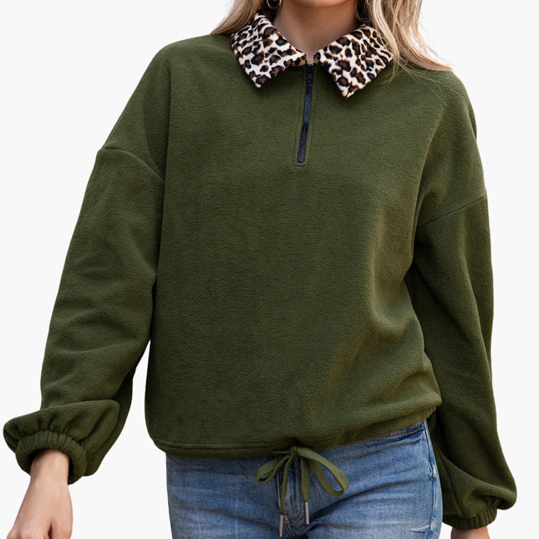 Women's relaxed-fit fleece pullover half-zip with contrasting leopard print collar and adjustable hem