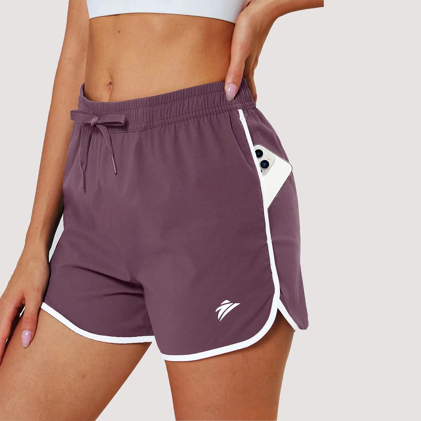 Women's black running shorts with 7-pocket design, quick-dry nylon-spandex fabric, athletic fit