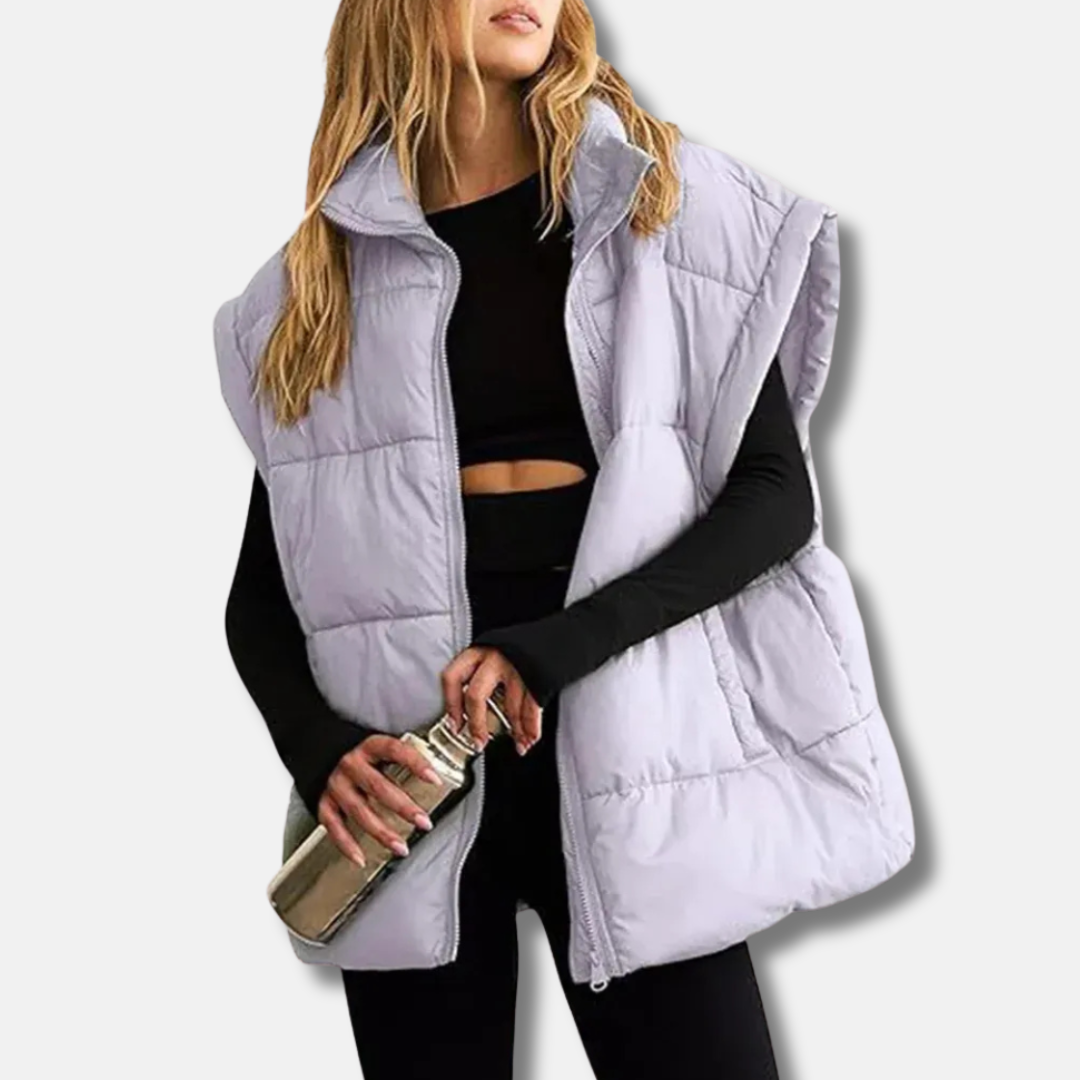 Women's quilted puffer vest stand collar hip-length warm layering essential in sleek solid color