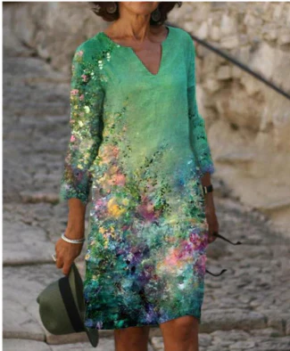 Women's floral midi dress, V-neck, artistic face print with delicate floral accents, sophisticated everyday style