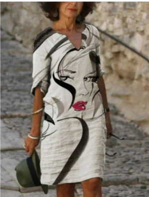 Women's floral midi dress with V-neck, artistic face print, and delicate floral accents for everyday wear