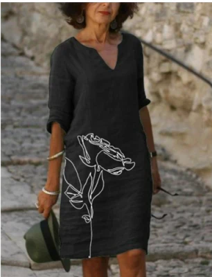 Women's floral midi dress, V-neck, artistic face print with delicate floral accents, sophisticated everyday style