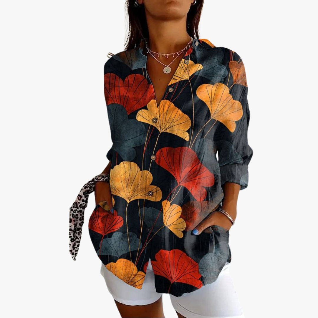 Women's white linen blouse with handcrafted embroidery, relaxed fit, timeless artisanal style