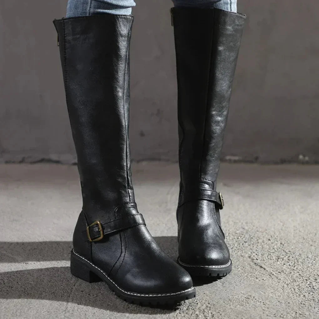 Women's black knee-high buckled boots sleek silhouette with decorative buckles for versatile styling