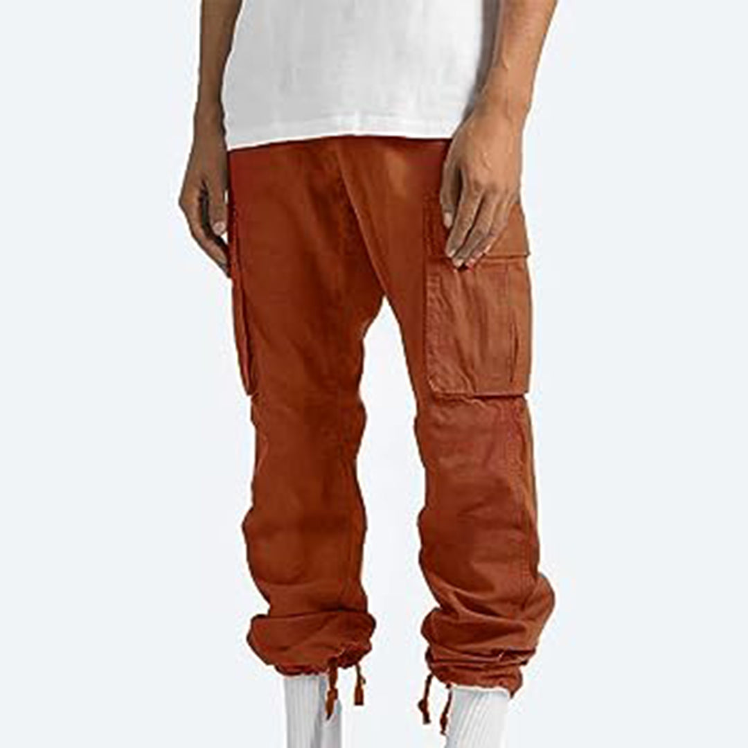 Men's relaxed fit cargo pants in neutral tone, multiple utility pockets, durable cotton blend streetwear style