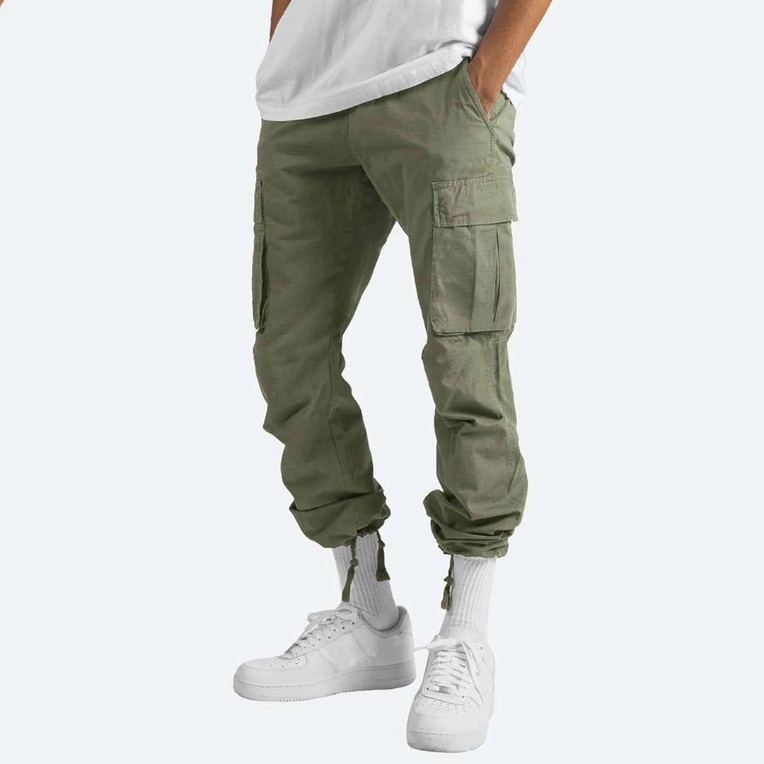 Men's relaxed fit cargo pants in neutral tone, multiple utility pockets, durable cotton blend streetwear style