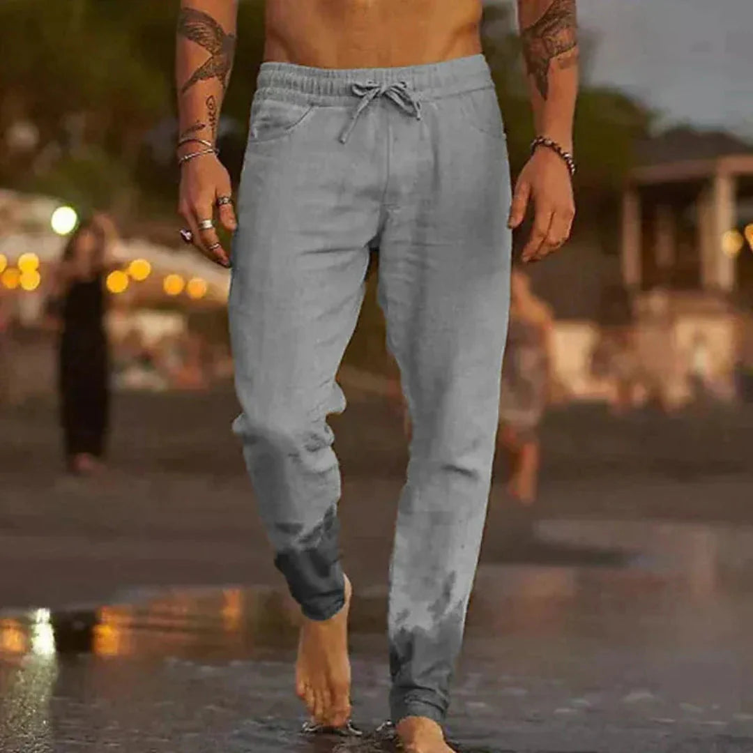 Men's beige linen tapered pants with elastic waistband and drawstring, relaxed breathable fit
