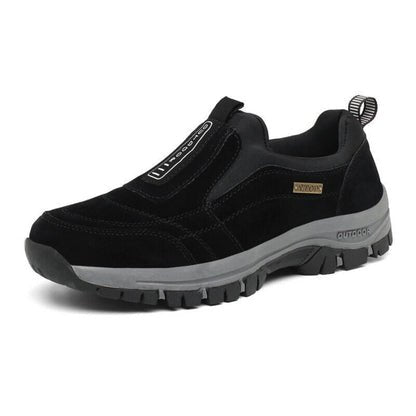 Olive green slip-on trail shoes with rugged tread outsole and cushioned midsole for outdoor use