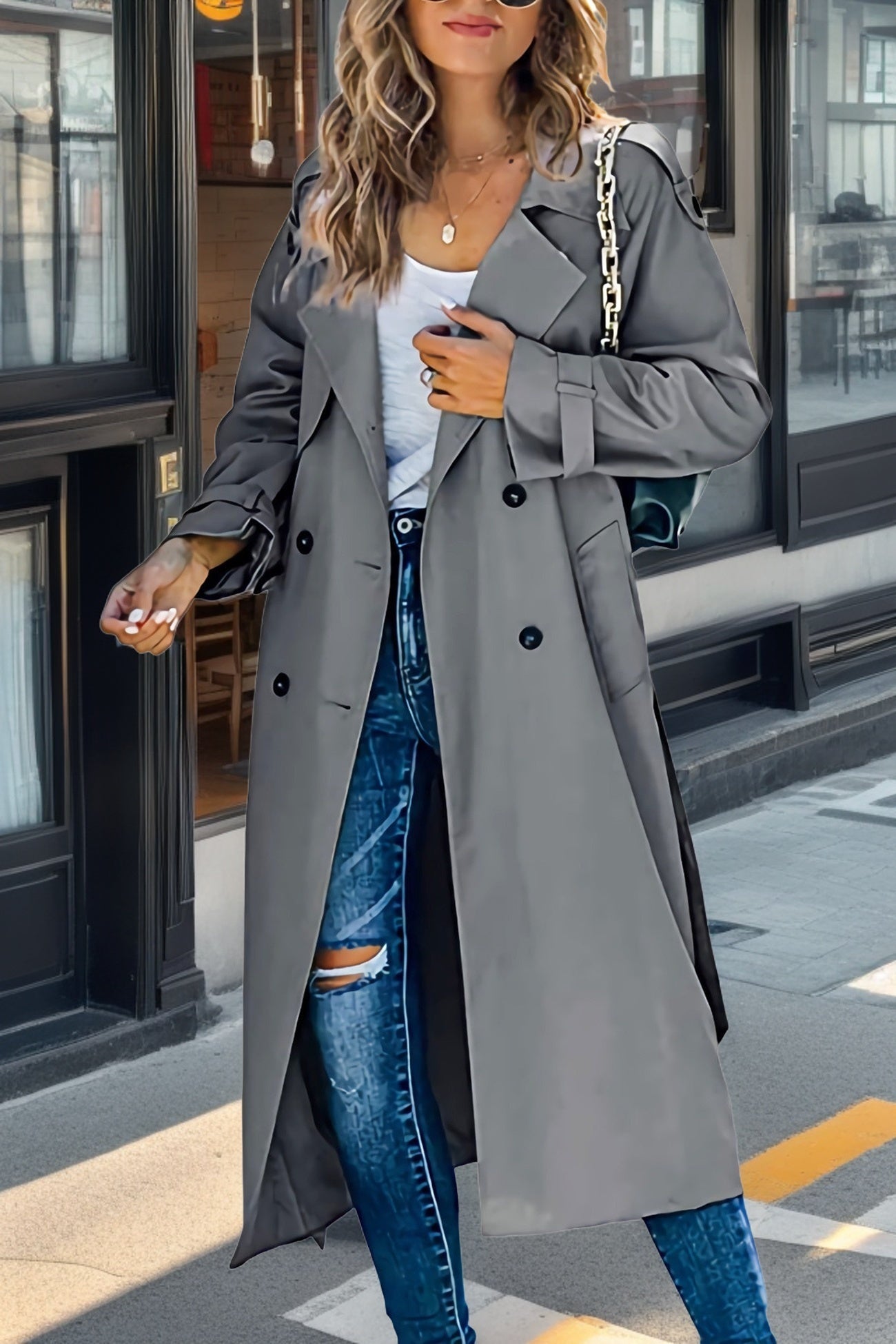 Women's beige double-breasted long trench coat with classic lapels and adjustable sleeves