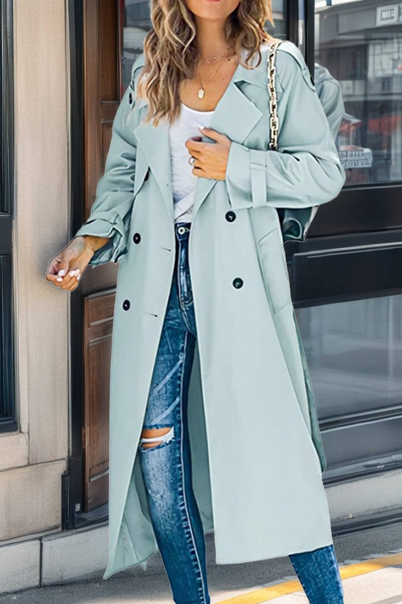 Women's beige double-breasted long trench coat with classic lapels and adjustable sleeves
