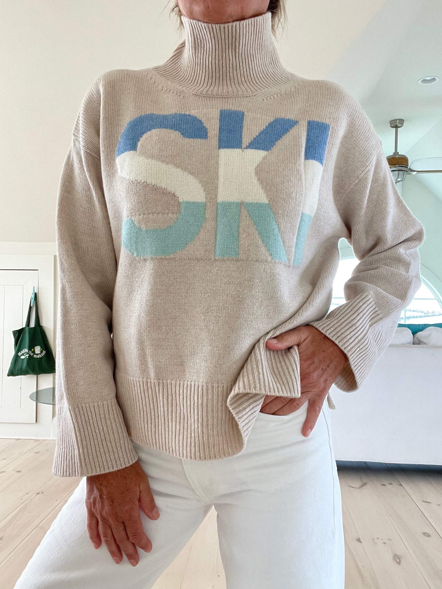 Oversized retro turtleneck ski jumper with bold intarsia stripe detailing and cozy vintage knit silhouette