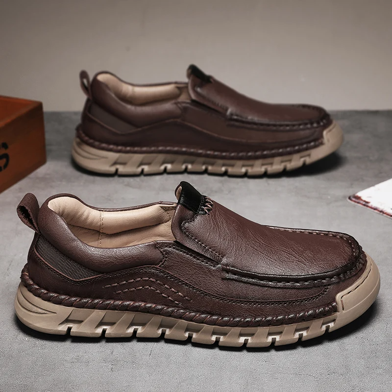 Men's brown leather slip-on loafer with hand-stitched artisanal detailing and shock-absorbing sole