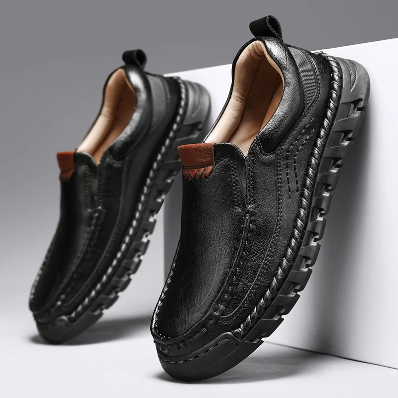 Men's brown leather slip-on loafer with hand-stitched artisanal detailing and shock-absorbing sole