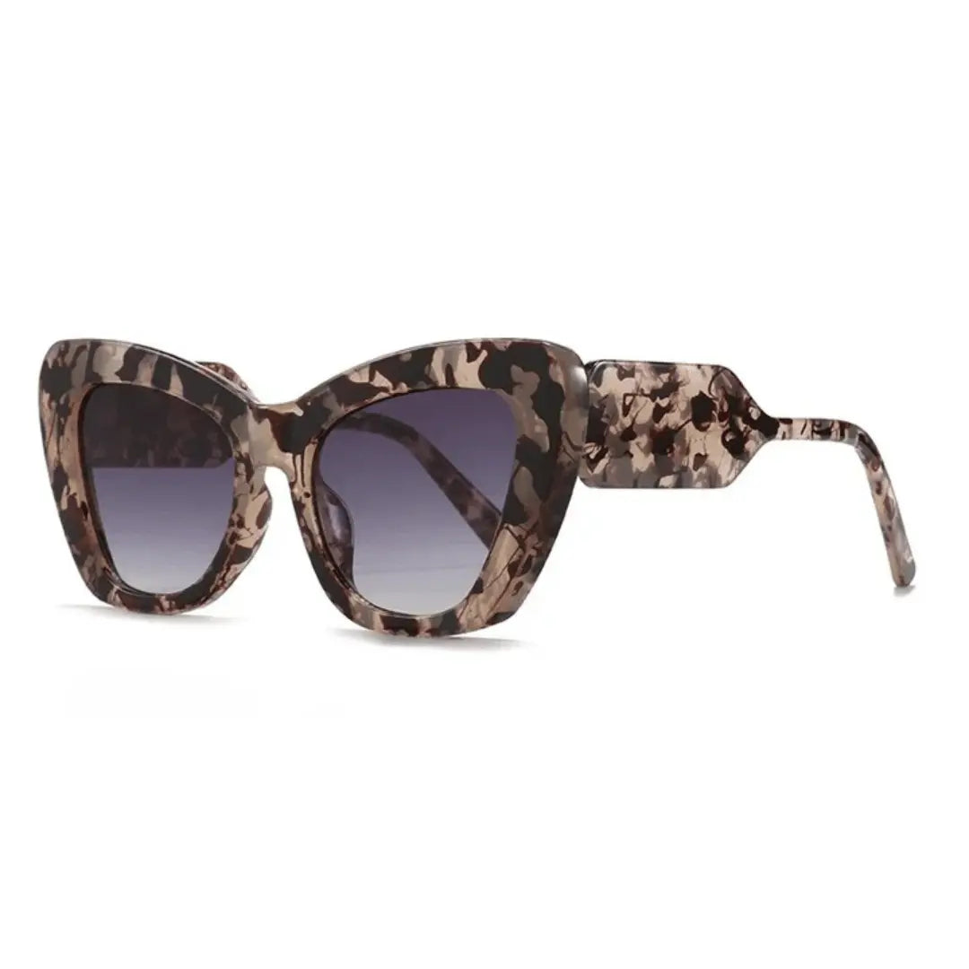 Women's retro cat-eye sunglasses with bold patterned temples, full-rimmed vintage-modern silhouette
