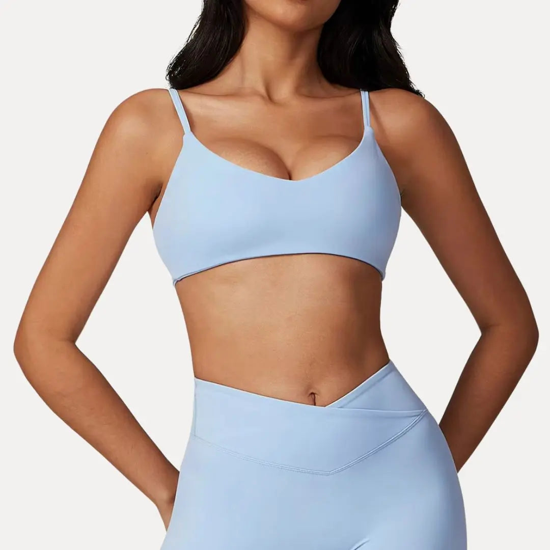 Luna strappy sports bra light medium support flexible straps minimalist silhouette for active women