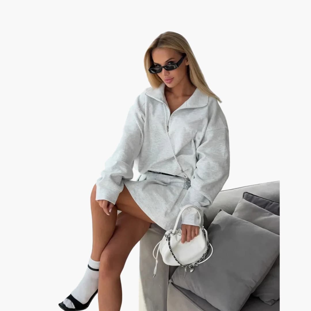 Women's long sleeve half-zip dress with pleated hem in elegant office-ready silhouette