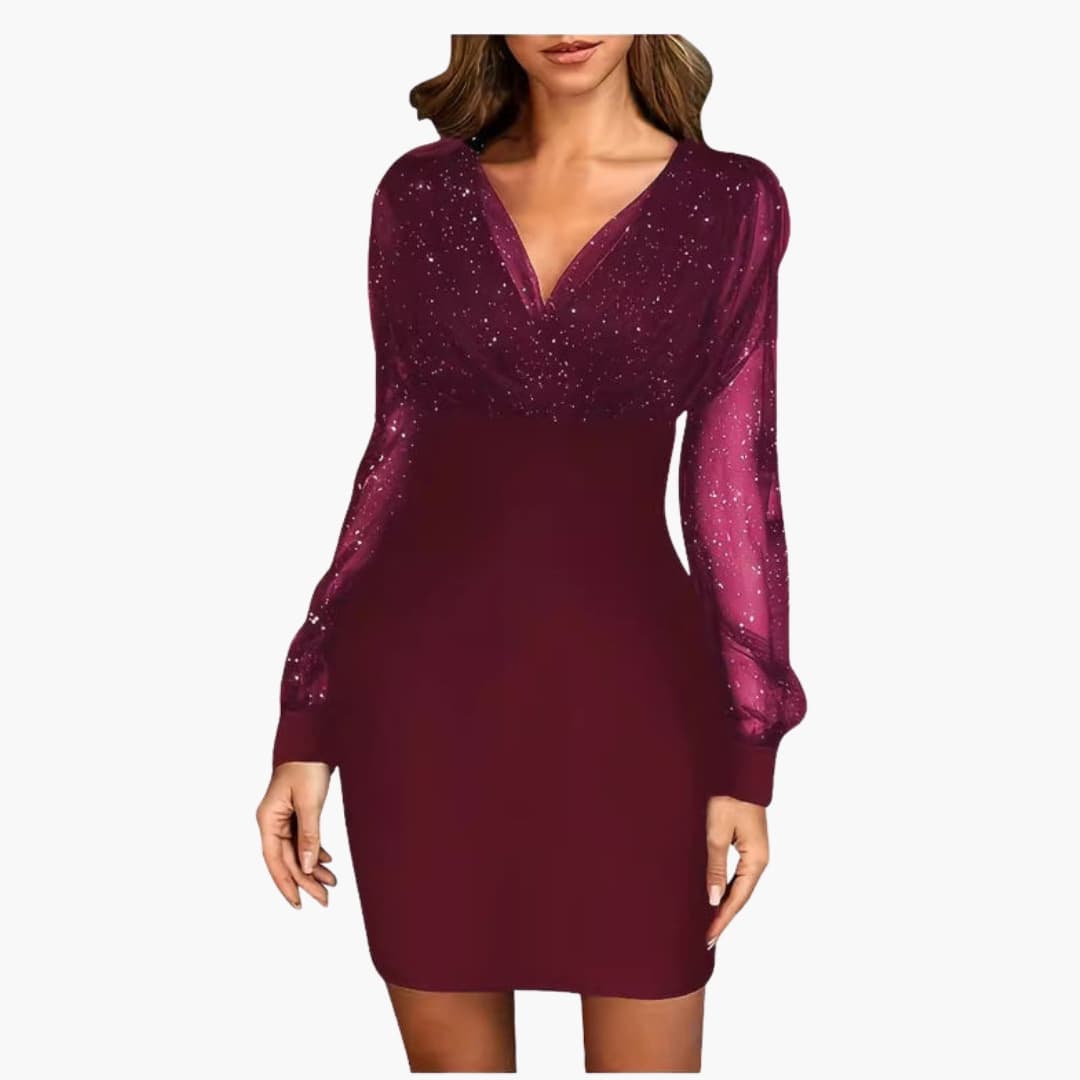 Women's silver sequin cocktail dress with sheer sleeves, V-neckline, and tailored festive fit