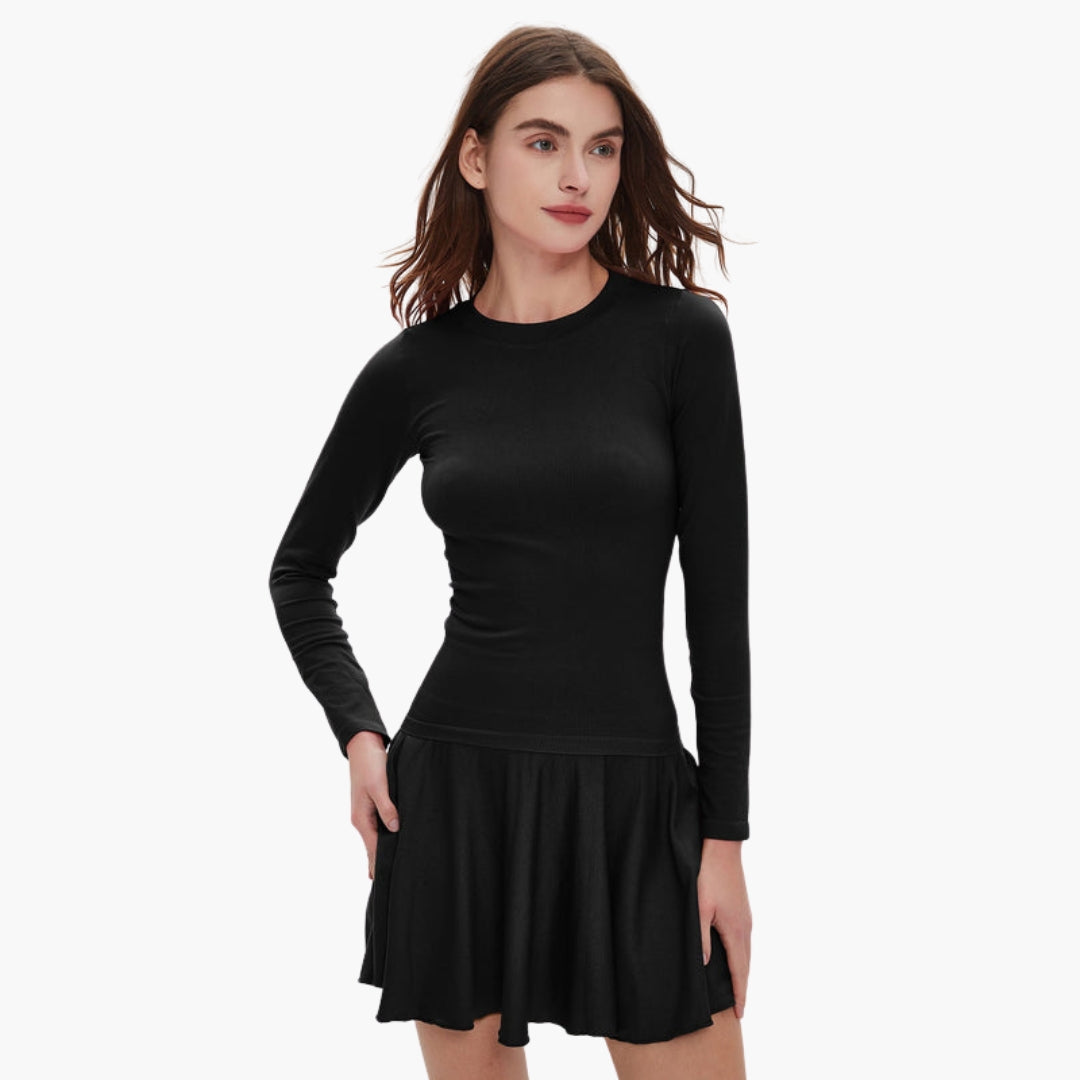 Women's long sleeve round neck dress with fitted waist, fluid draped skirt, and side pockets