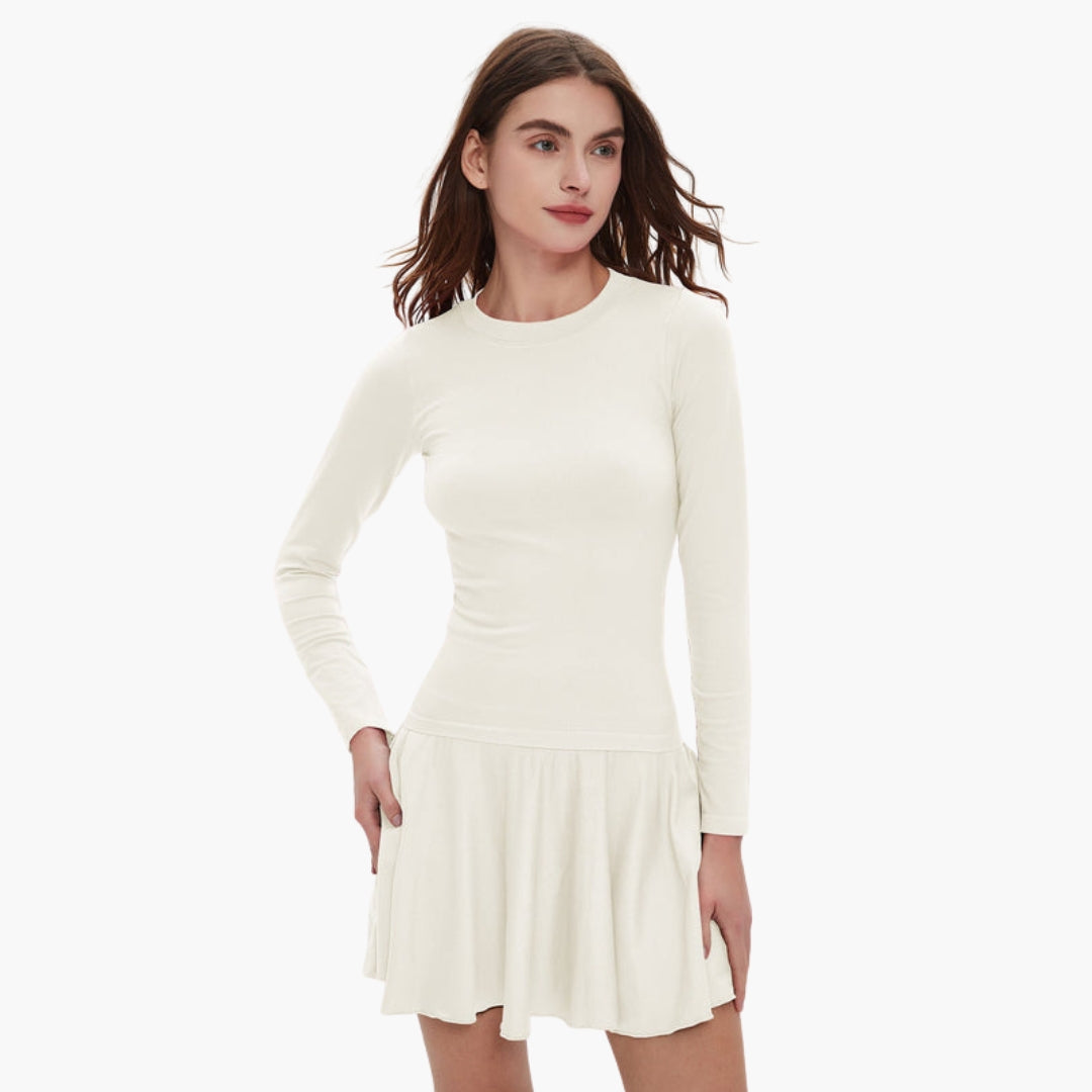 Women's long sleeve round neck dress with fitted waist, fluid draped skirt, and functional pockets