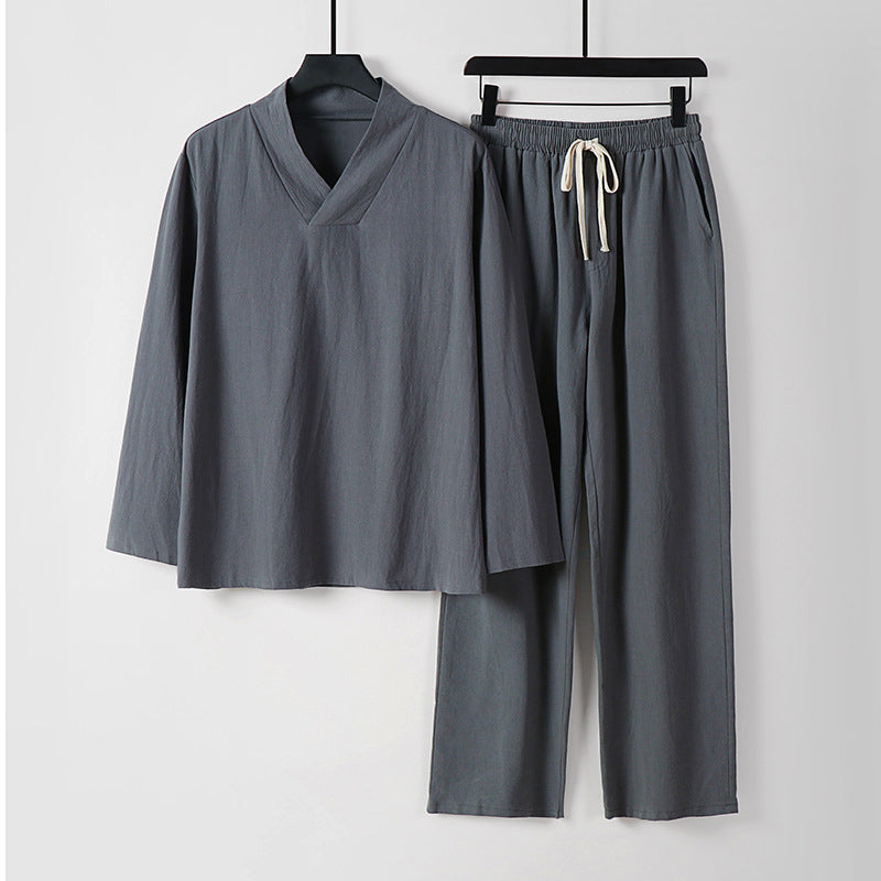 Men's gray two-piece loungewear set with V-neck long-sleeve top and matching drawstring pants