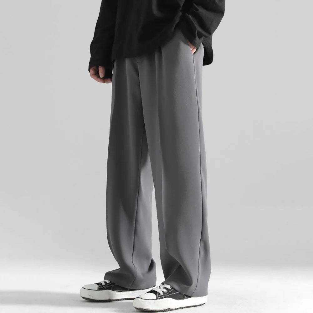 Roberto Russo black wide-leg relaxed trousers with fluid drape, modern luxury urban style