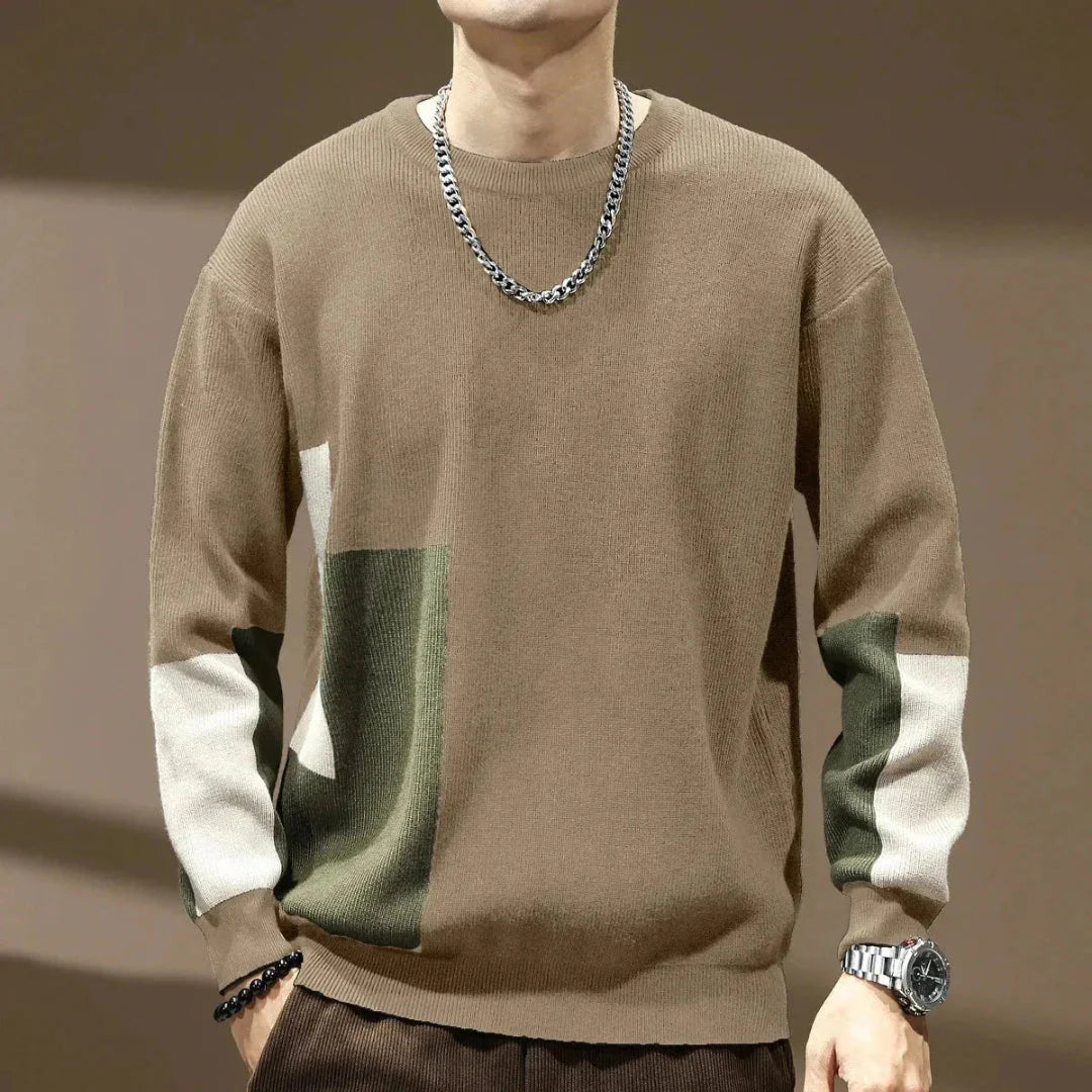 Men's color block knit crewneck sweater with bold geometric panels and contrasting sleeves relaxed fit
