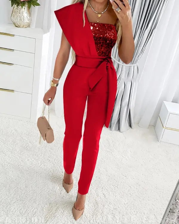 Women's silver sequin one-shoulder jumpsuit with shimmery stretch fabric and asymmetrical neckline