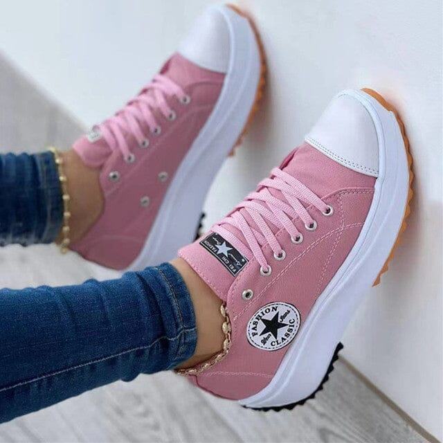 Women's white low-top canvas chunky sole sneakers with bold platform silhouette for casual style