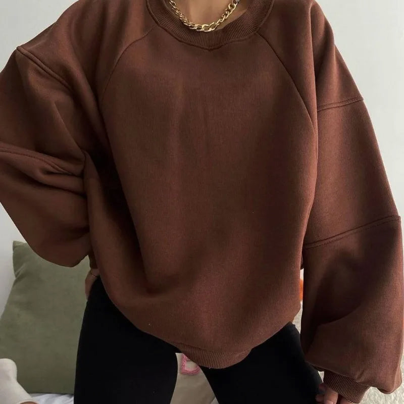 Women's oversized pullover sweatshirt in cozy plush fabric, relaxed winter loungewear silhouette