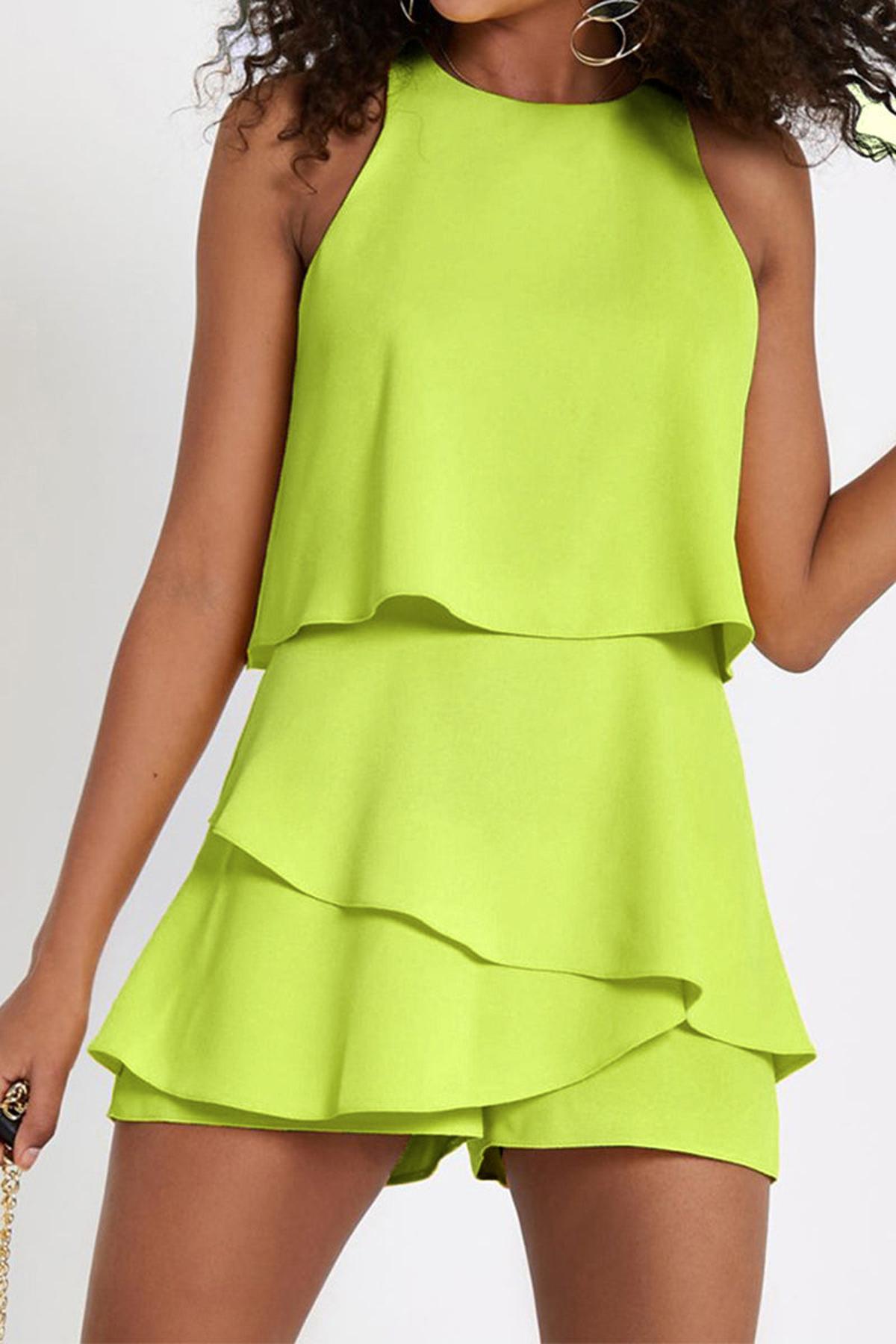 Women's sleeveless romper with ruffled flowing overlay, flattering chic silhouette for summer