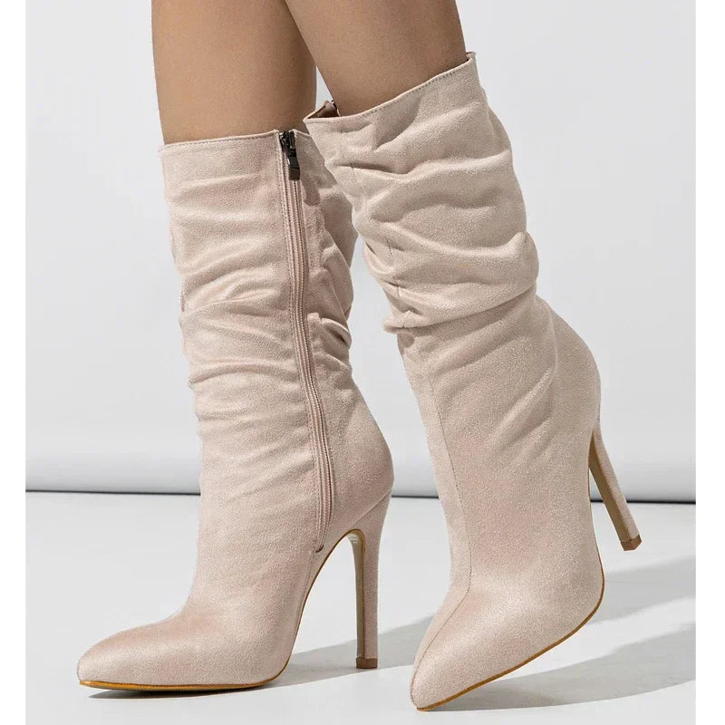 Black velvet stiletto boot with slouchy shaft and pointed toe, chic evening style