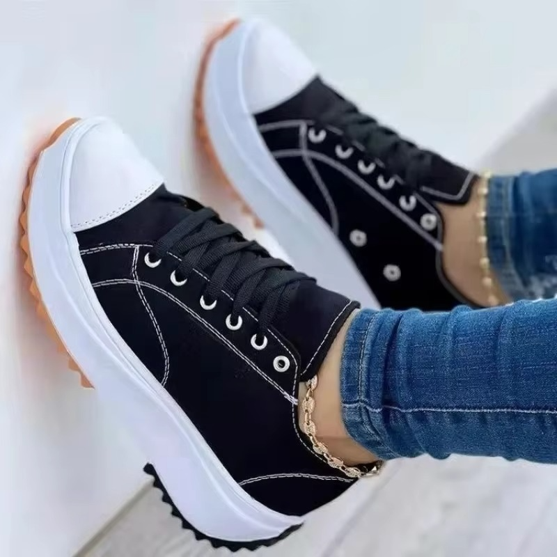 Women's white canvas platform sneakers with breathable upper, lightweight sole, and casual everyday style