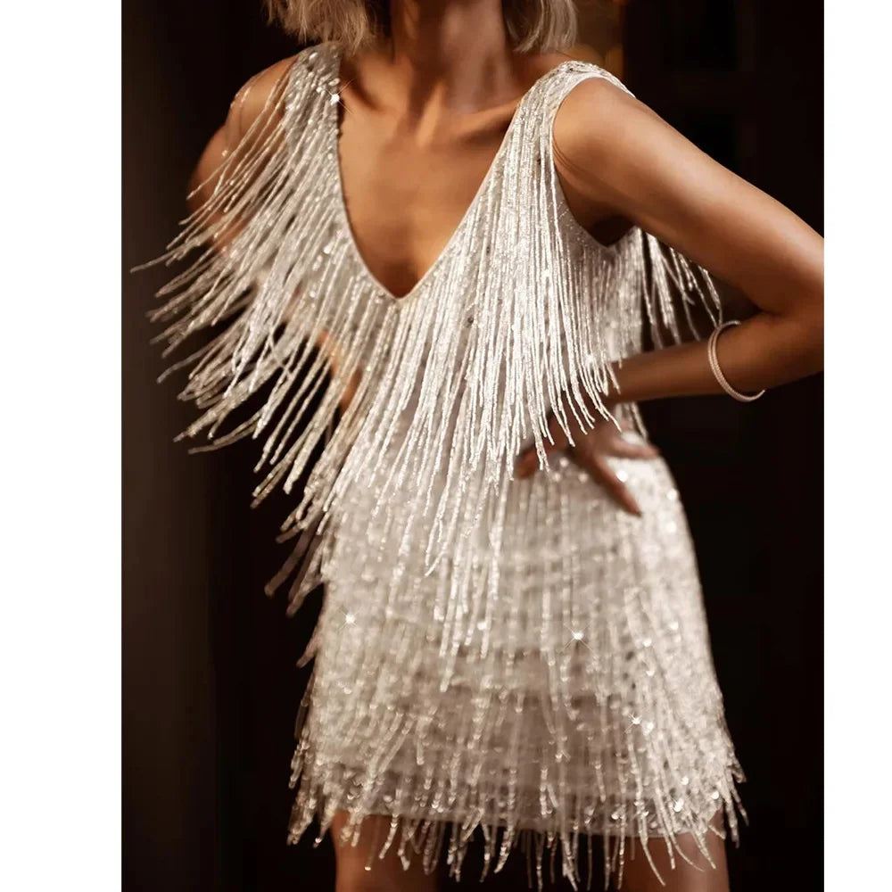 Women's black A-line cocktail dress with fringe feather trim for glamorous playful movement
