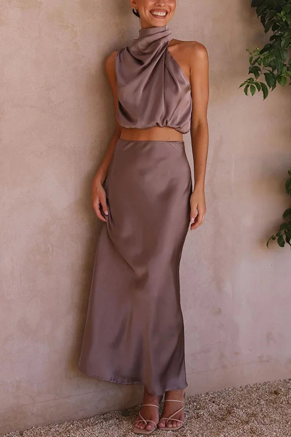 Women's elegant sleeveless skirt top set with asymmetrical neckline and button closure